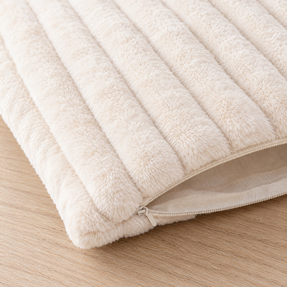 Corner of the Dune cushion cover with its zip open, showing it is a cover only