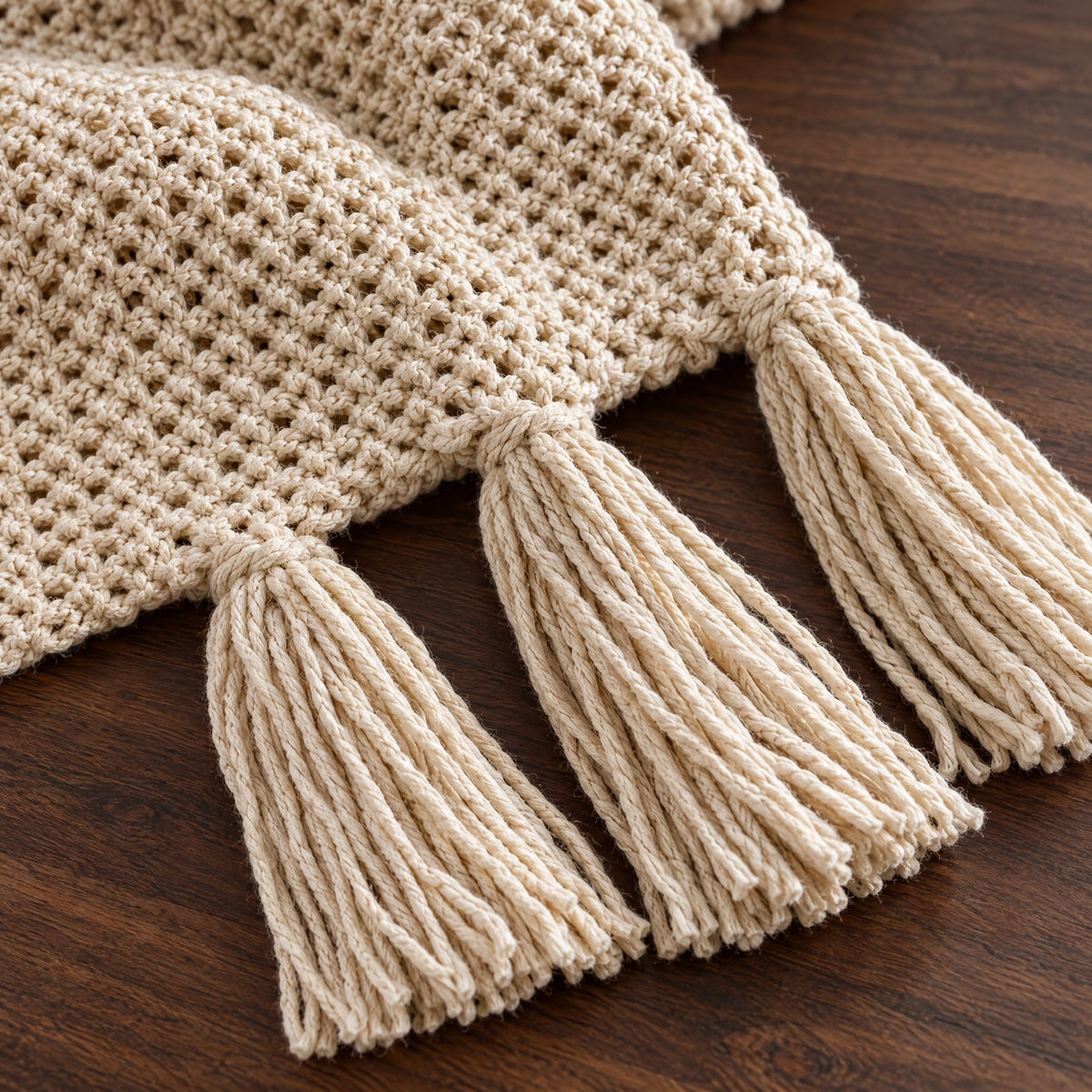 Close view of the honeycomb knit and tassels of the Fenn throw
