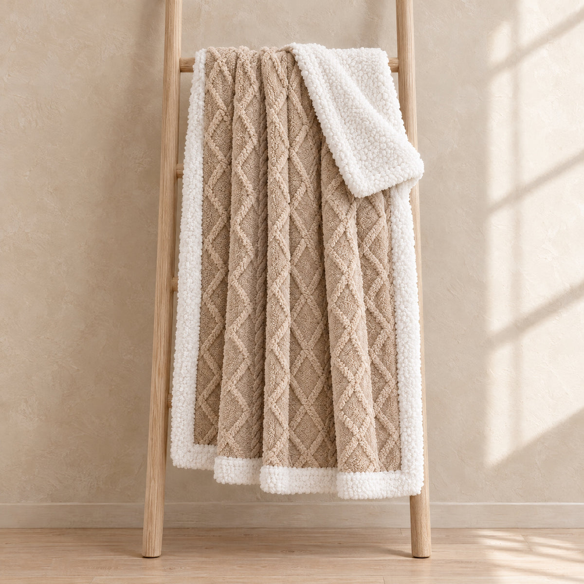 Harbour Cable Sherpa Throw in Beige on a blanket ladder